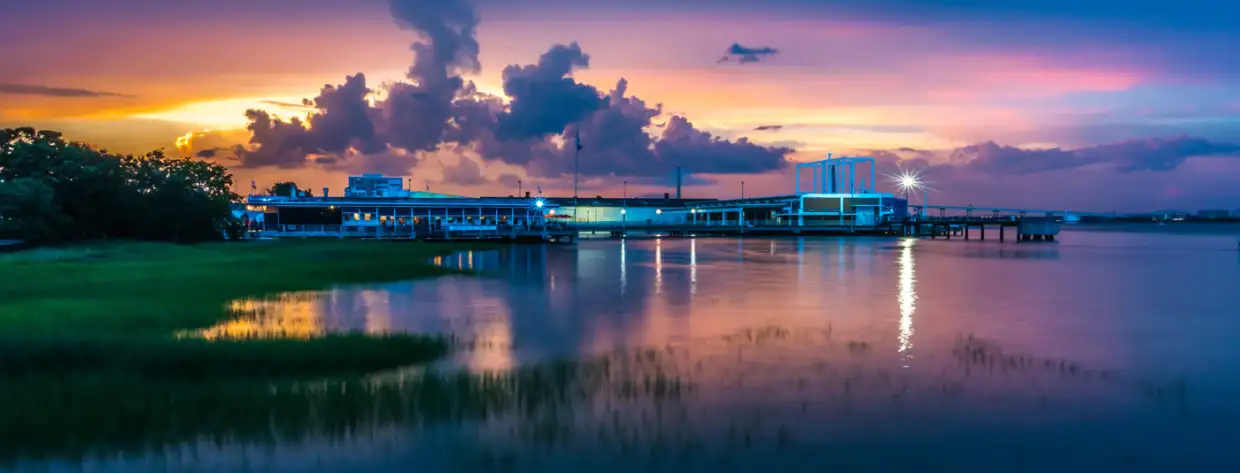 Blue-hour over Charleston Harbor, the marsh and the lit pier