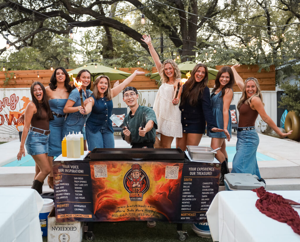 Let's Hibachi chef putting on a flame show on a portable teppanyaki grill at a Charleston party rental